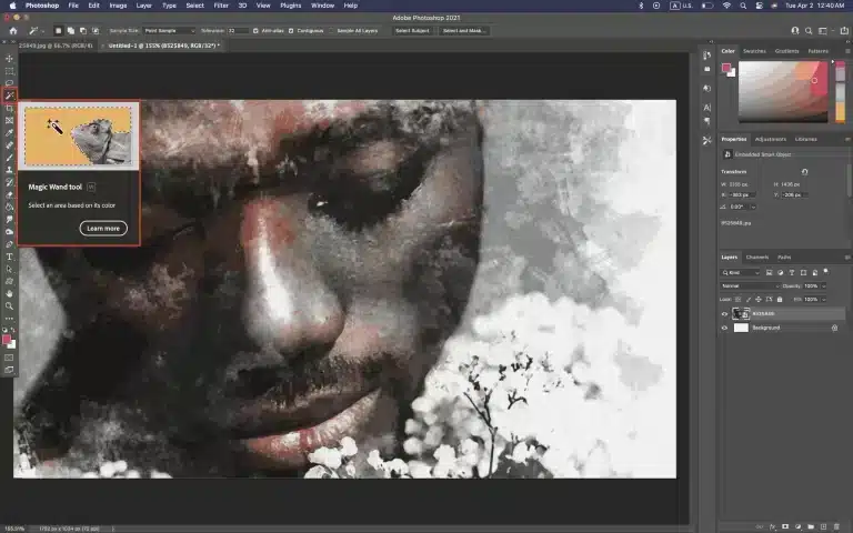 Graphic designer using the Magic Wand Tool in Photoshop for precise selection, in a modern workspace setting.