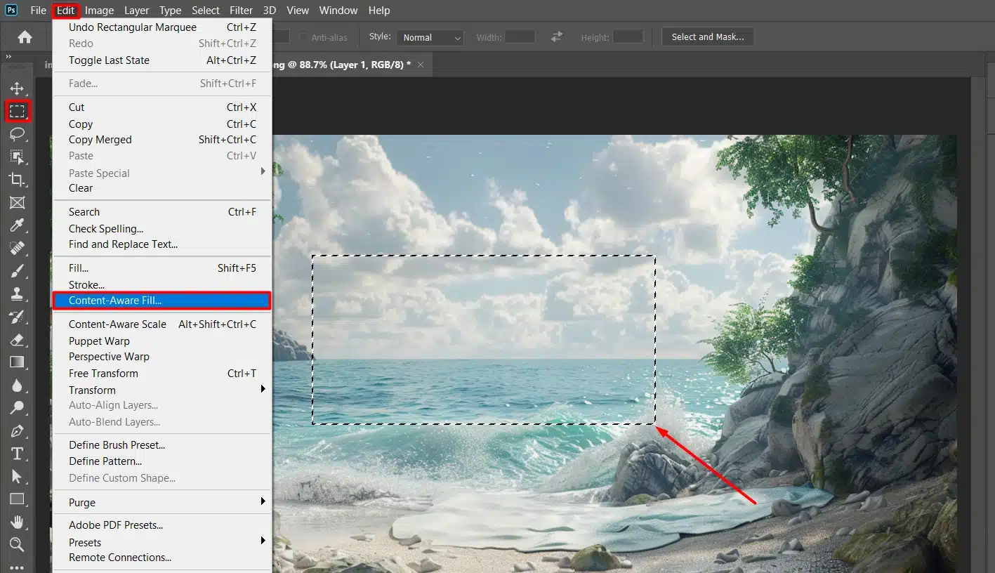 interface showing the Content-Aware Fill option highlighted in the Edit menu with a image of a beach scene. The selection area is visible with a red arrow pointing to the selected region.