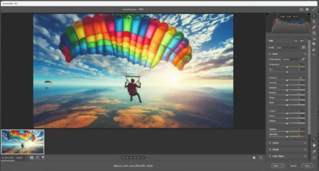 A skydiver under a rainbow-colored parachute gliding through the air with a scenic landscape and sunset in the background, displayed in the Adobe Camera Raw editing interface.