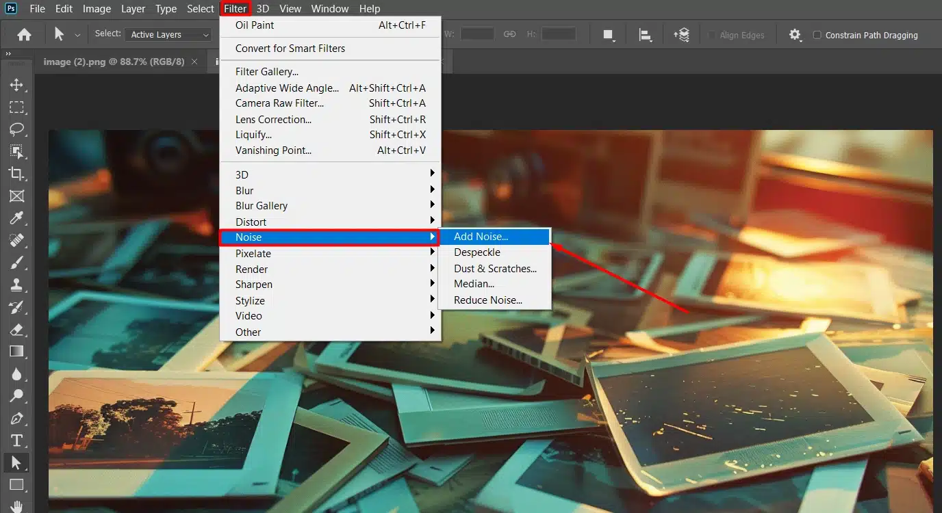 Photoshop interface with 'Noise' option highlighted under the 'Filter' menu, photo of scattered Polaroid-style photos.