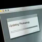 Close-up of a computer monitor showing the update interface of Adobe Photoshop with version 2024 mentioned on a progress bar.