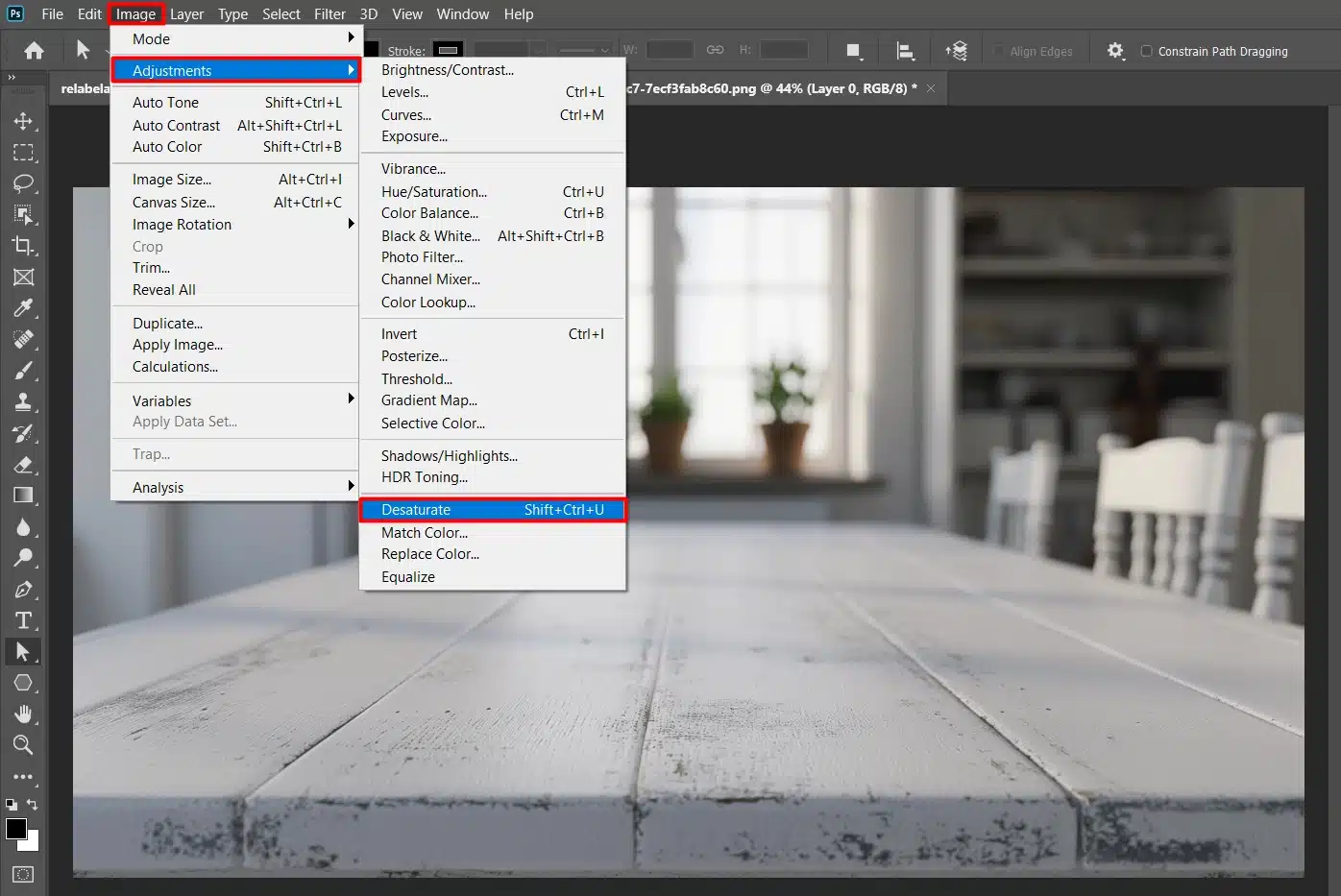 A screenshot of Adobe Photoshop with the Image menu open, highlighting the Adjustments option and Desaturate selection