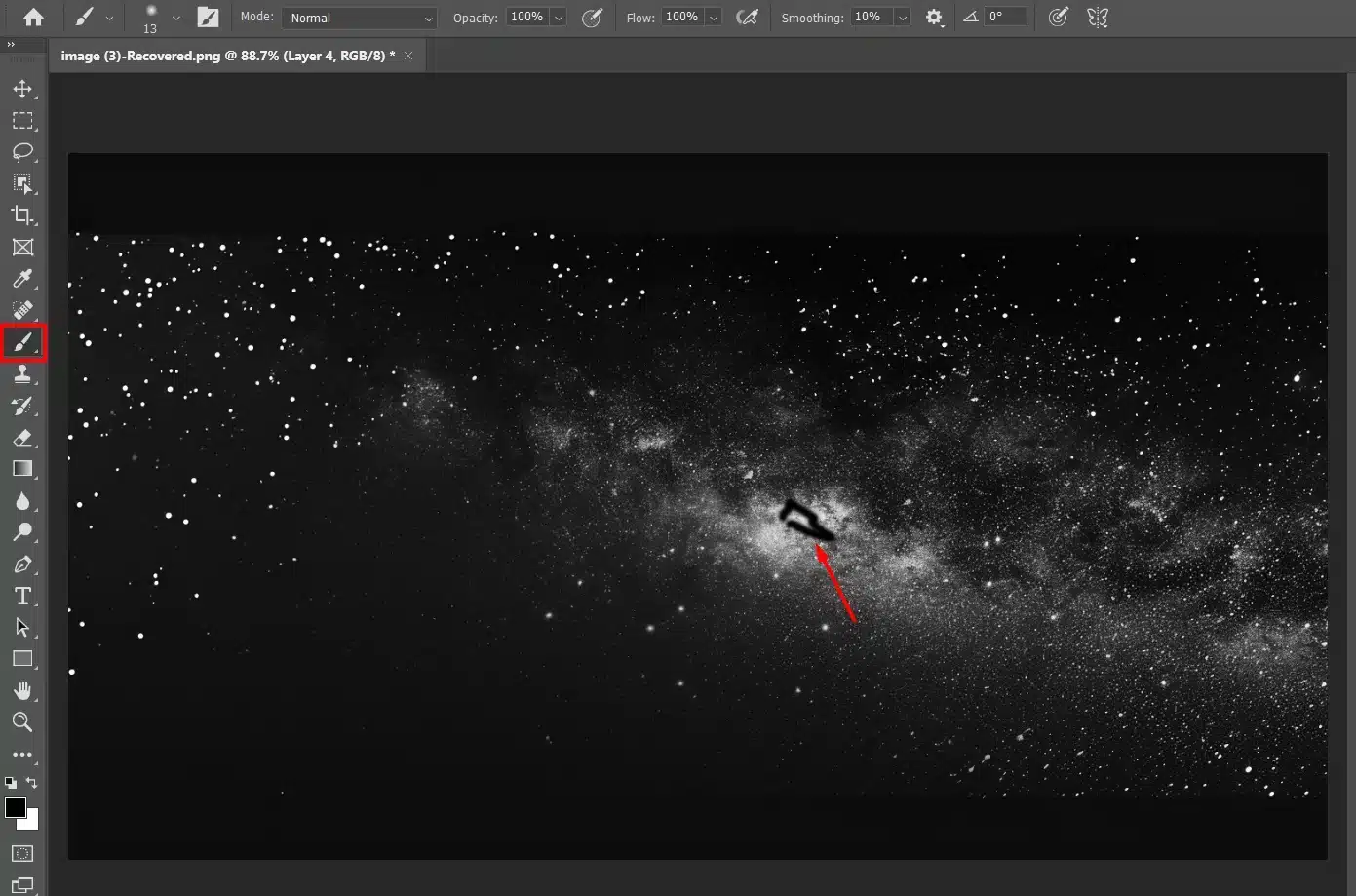 Photoshop interface displaying the use of a brush tool with a layer mask applied to an image of a black night sky.