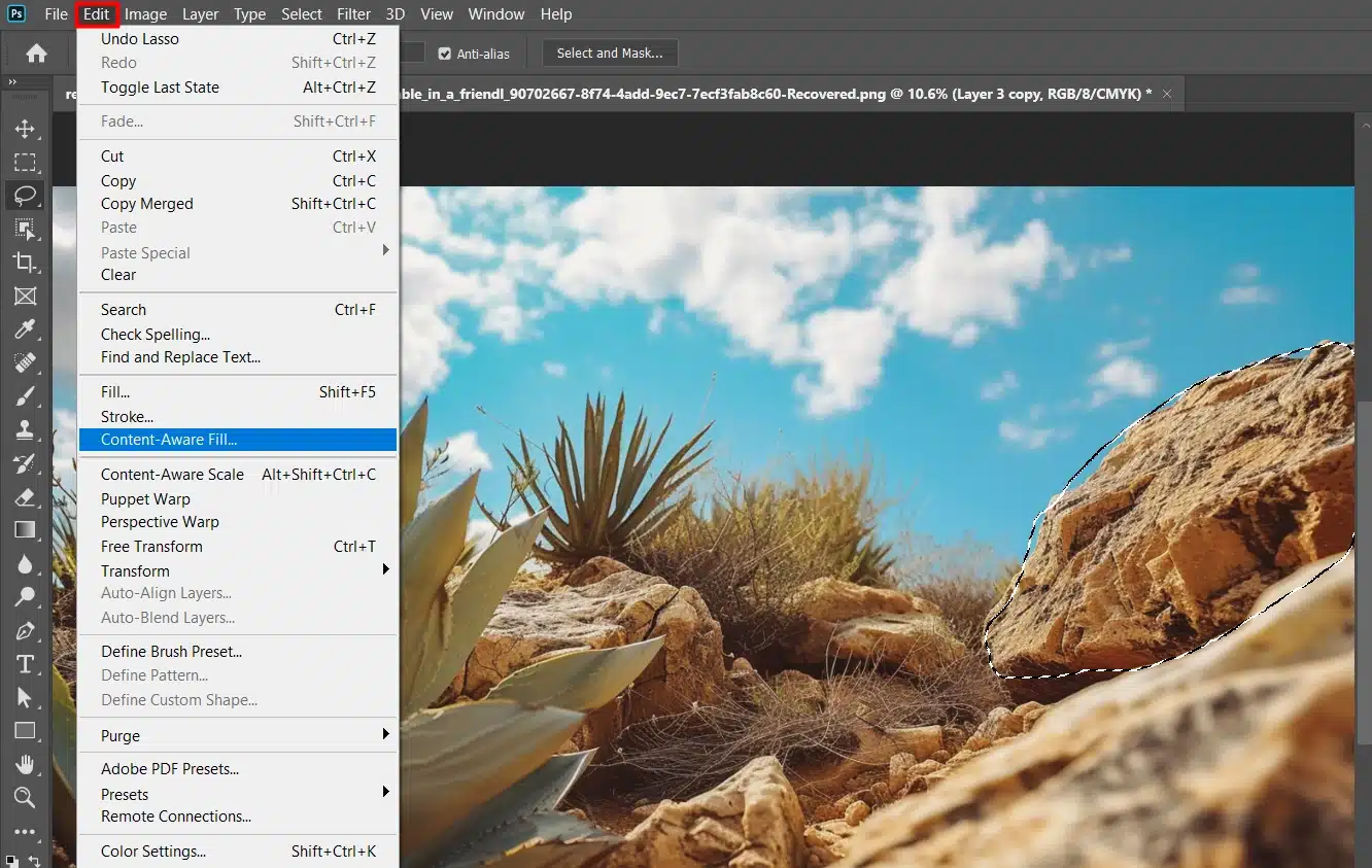 Screenshot of Photoshop's Edit menu with the Content-Aware Fill option highlighted, and a desert plant landscape in the background