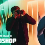 A person holding a camera in front of a looking glass with vibrant colors reflecting, demonstrating reflecting a photo in Ps for creative effects