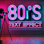 A photographer capturing an 80s-inspired neon text effect on a brick wall. The glowing pink and blue text reads "80's Text Effect" under vibrant studio lights, showcasing a retro aesthetic.