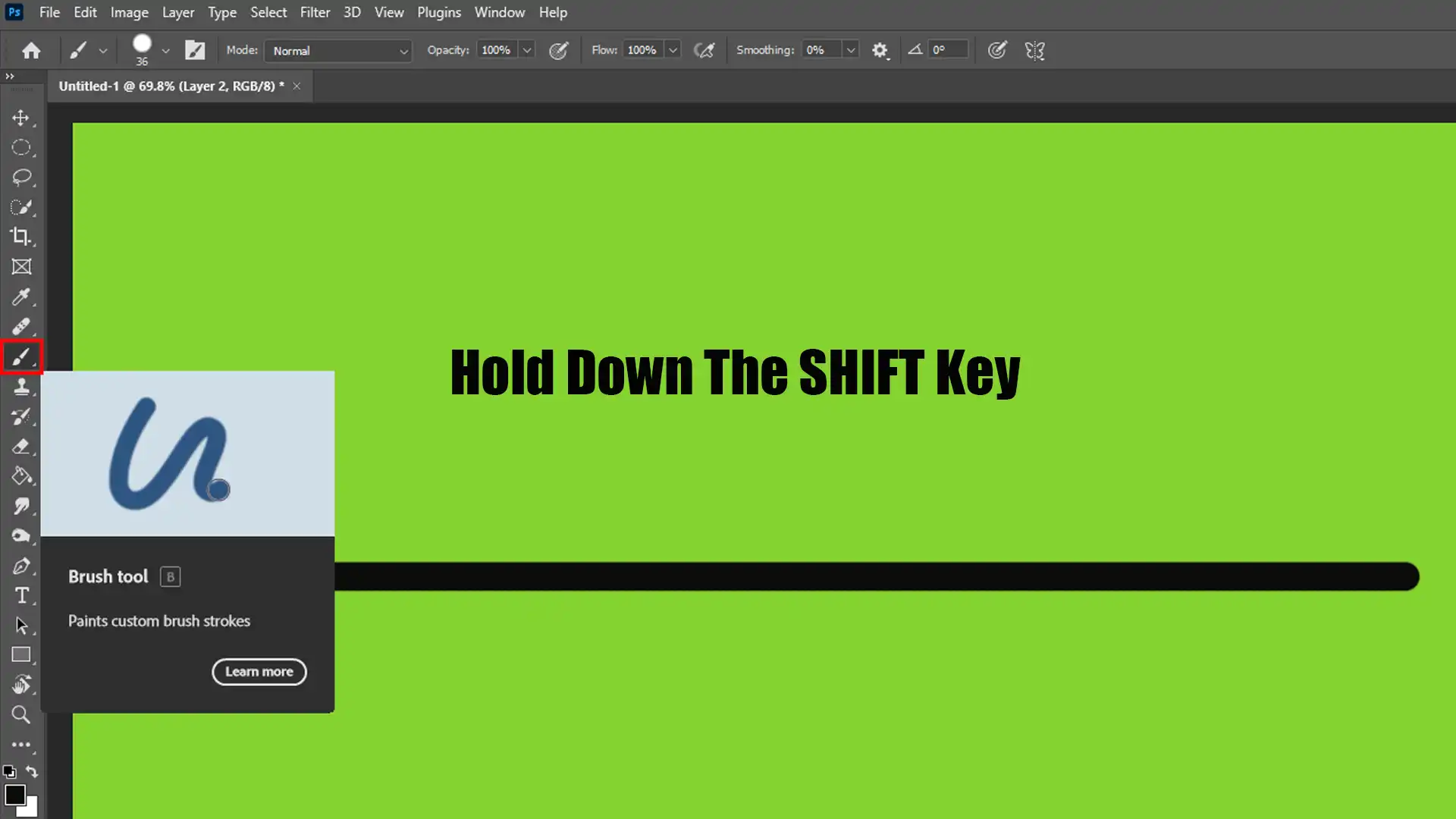 A black straight line drawn on a green canvas in Photoshop using the Brush Tool while holding down the Shift key.