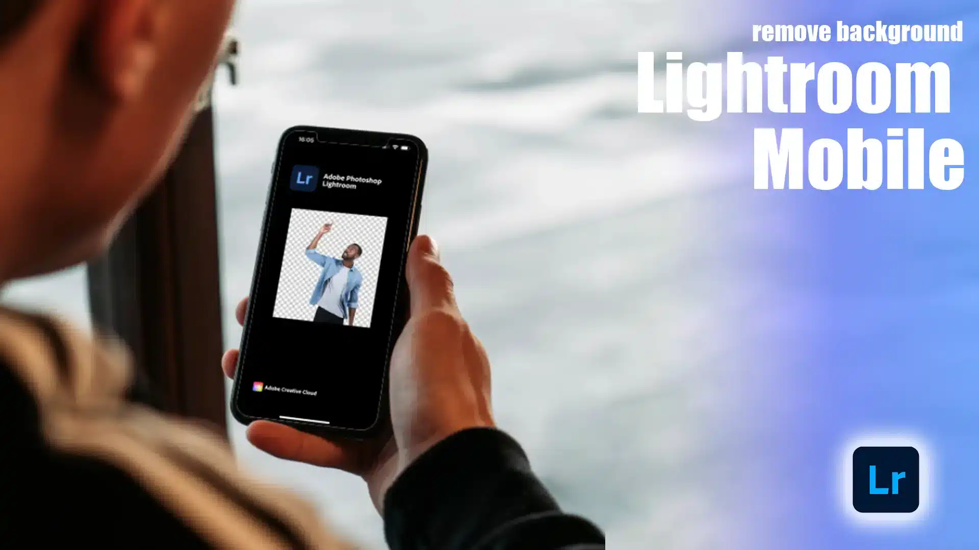 Person holding a smartphone displaying LR smartphone application interface with an edited image where the behind surroundings has been extracted.