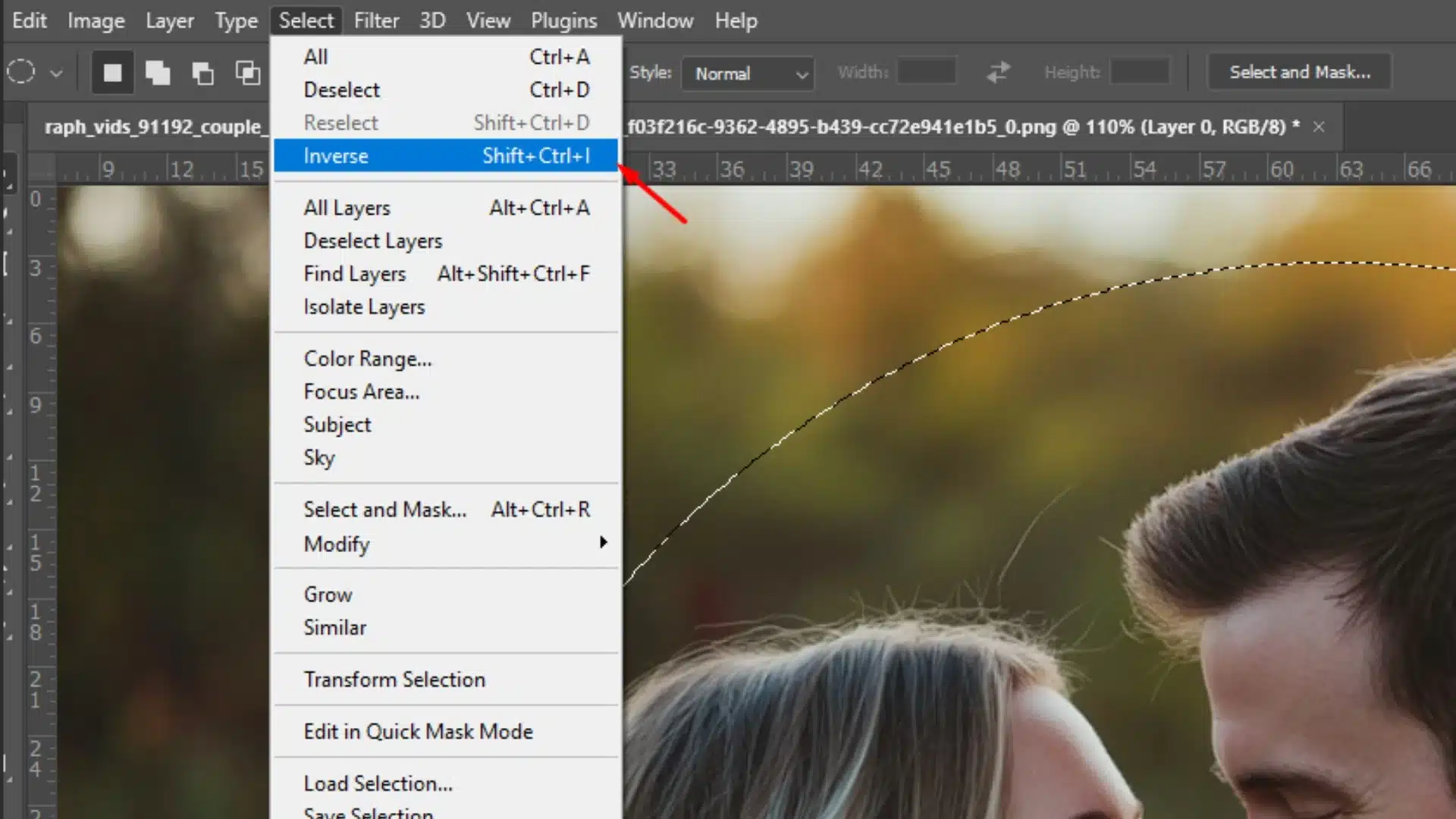 Screenshot of Photoshop showing how to invert a selection using the Select > Inverse option from the menu.