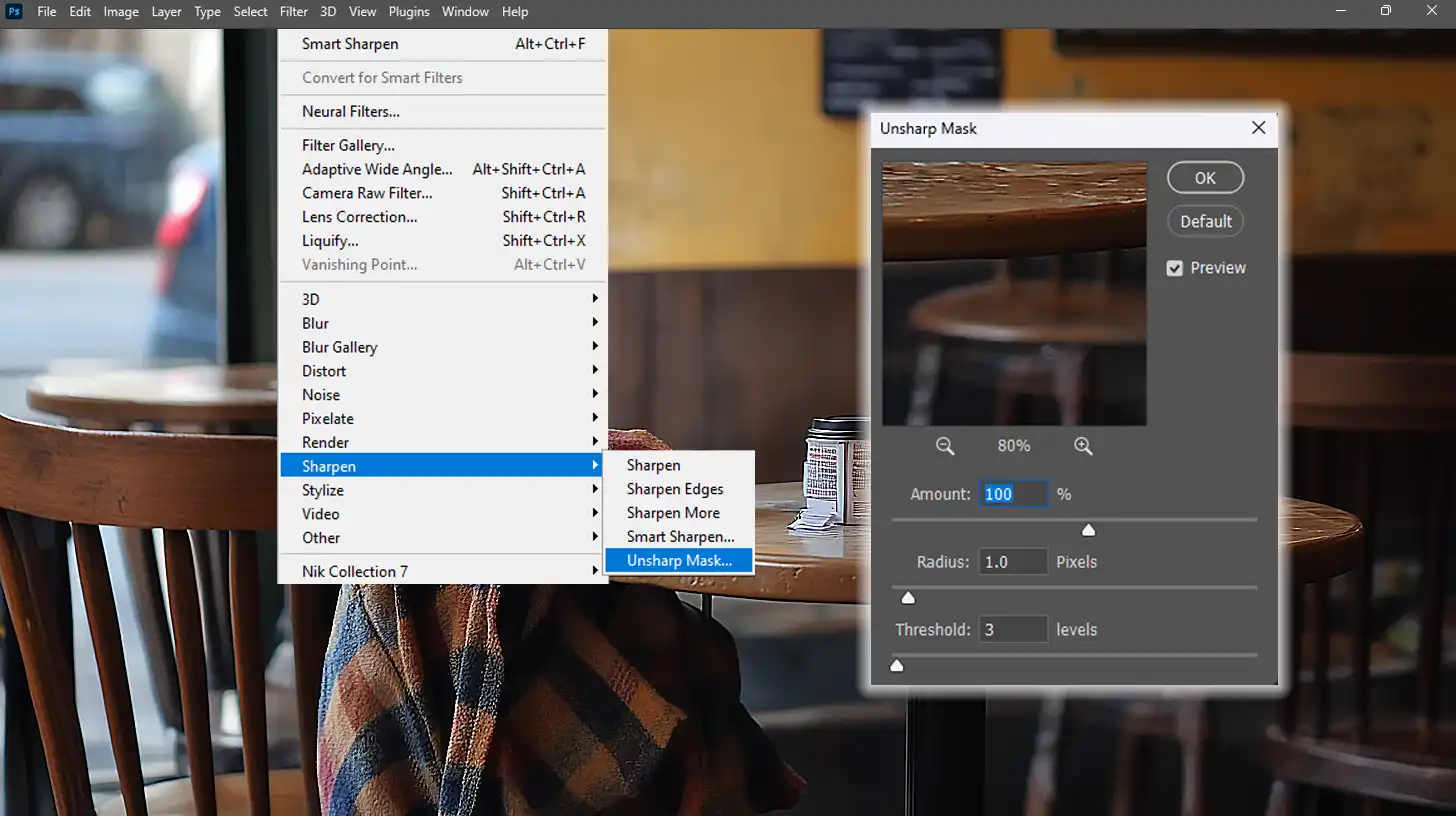 Photoshop's "Unsharp Mask" filter dialog showing settings for adjusting sharpness, radius, and threshold for clearer images