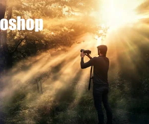 A photographer in a forest captures sunlight streaming through trees, creating dramatic light rays. The bright beams and shadows highlight the use of light rays Photoshop effects.