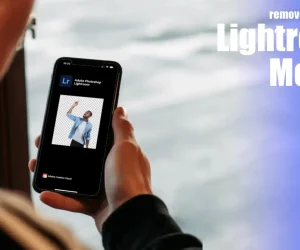 Person holding a smartphone displaying LR smartphone application interface with an edited image where the behind surroundings has been extracted.